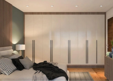 Modern bedroom with a large bed and built-in wardrobe, subtle lighting, and wooden accents.