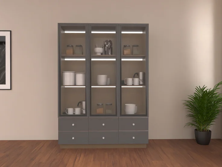 A modern glass-fronted cabinet with dishes, beside a potted plant, in a room with framed art.