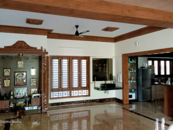 Enjoy a spacious room featuring ceiling beams, a glossy floor, and elegantly traditional furniture