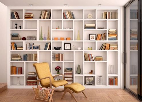 A charming room with a modern chair and bookshelves, offering a perfect setting for relaxation.