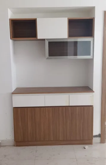 A stylish, two-toned wall-mounted cabinet featuring sleek open shelves & spacious closed compartments.