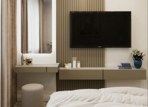 Bedroom one has a vanity table with a mirror, drawers & a TV mounted on wooden slats adorning the wall.