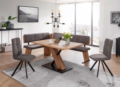 Modern dining room with a wooden table, six grey chairs, and a chandelier, overlooking a cityscape.