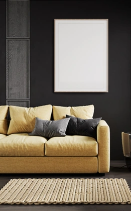 The contemporary living room with a yellow couch and artwork shows top interior designers' expertise