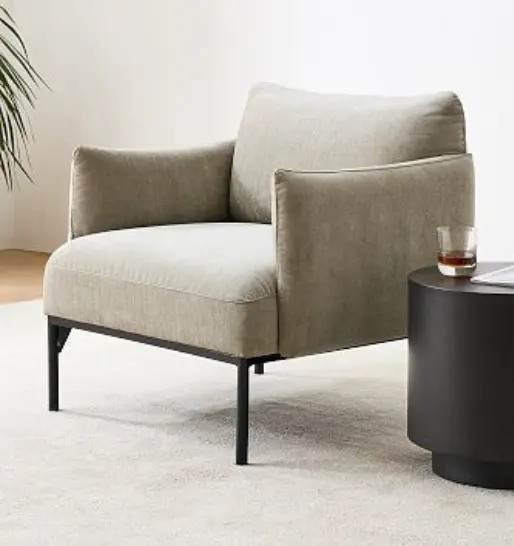A stylish modern chair paired with a side table, perfect for adding elegance to modern interiors.