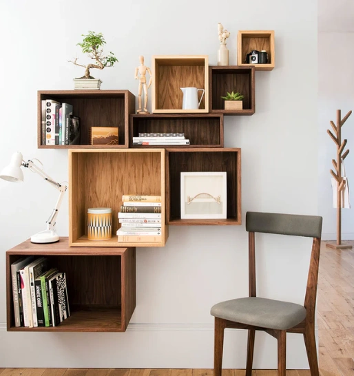 A wooden shelf displaying an array of books, showcasing stylish and functional design for any space.