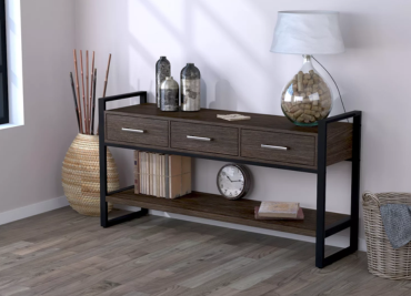 A modern hallway console with decorations and a wicker vase against a beautiful decor white wall.