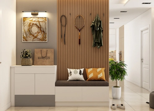 A modern entryway with a bench & wall highlights foyer furniture solutions for a welcoming atmosphere.
