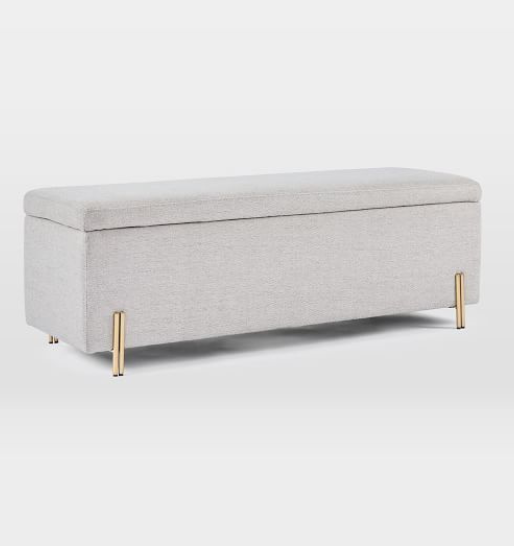 A blue ottoman with a durable black metal frame, perfect for enhancing the aesthetic of modern interiors