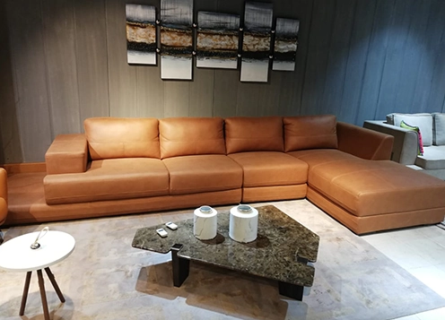 A stylish living room featuring leather furniture and a sleek coffee table, creating a modern.