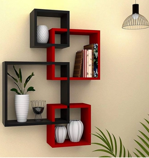 Modern wall shelves with red and black cubes display decorative items and books, with a lamp included.